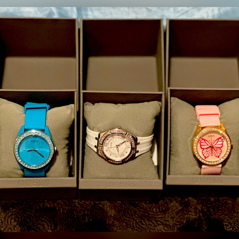 3 New Guess watches still in the original case with the price tag